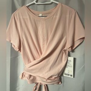 Lululemon size 12 Pink Tine to Restore SS back tie Women's Top. NWT